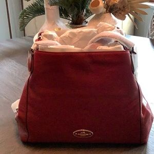 New  with tags Coach Edie red currant.